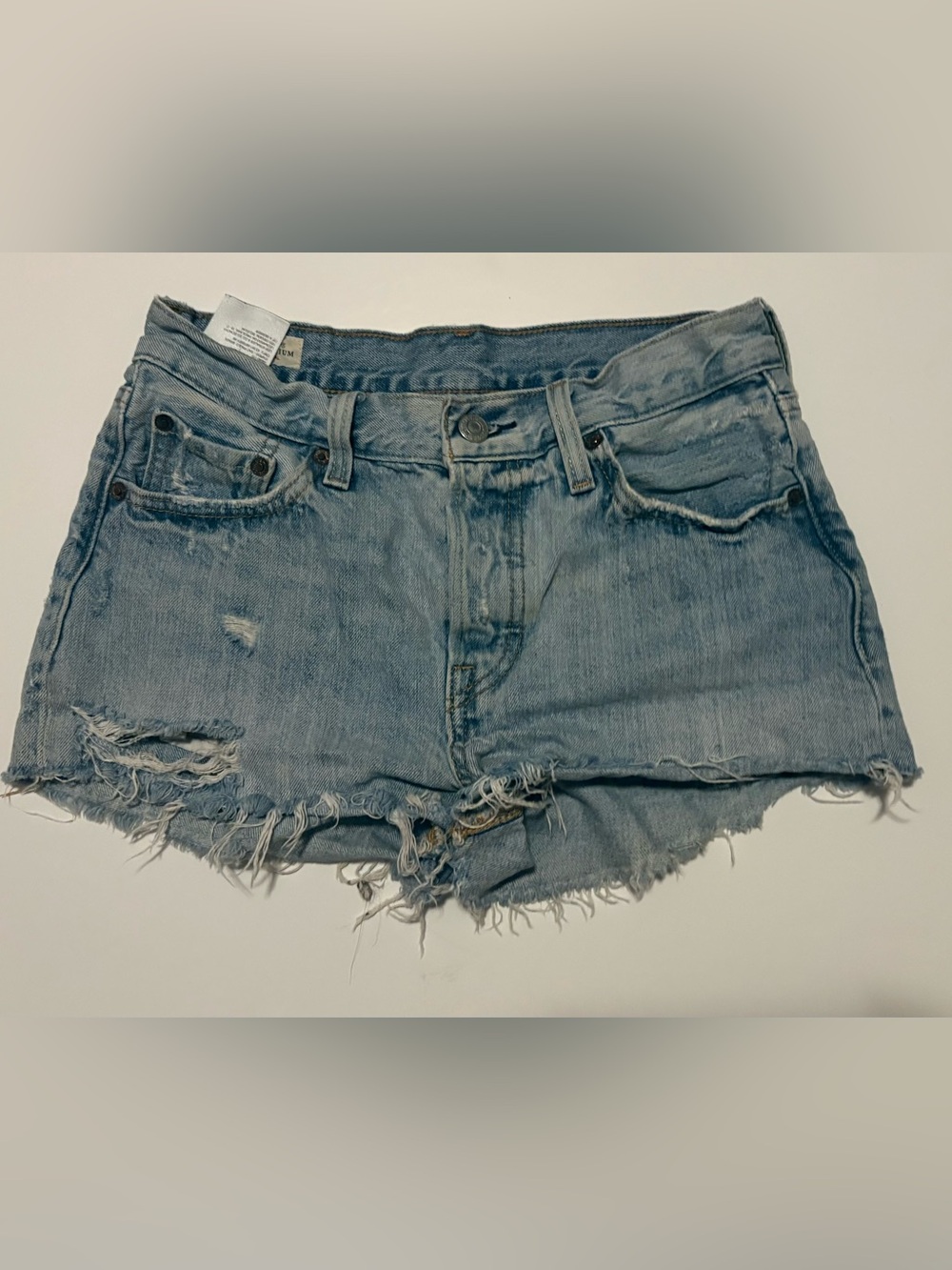 Levi’s 501 Distressed raw hem denim shorts 
Button fly SZ. 25 W EUC